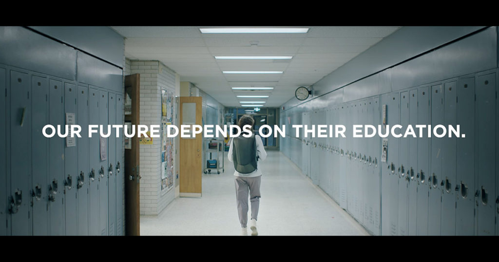 Student in Hallway with the words "Our Future Depends on Their Education"